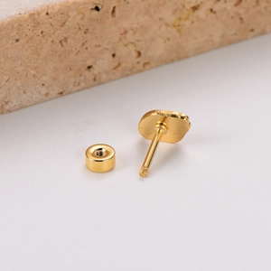 Close-up of gold strawberry earring with secure screw back and threaded post detail