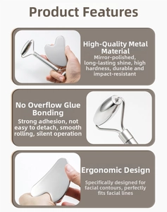 Close-up of polished stainless steel facial roller and heart-shaped gua sha massage tool