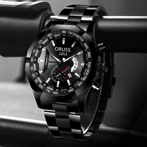 Detail of a black stainless steel quartz chronograph watch with tachymeter and date display