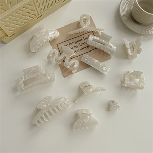 Elegant pearlescent white mermaid PVC hair claws in various styles for women hair styling