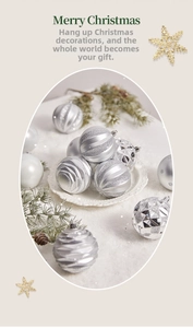 Detailed view of silver Christmas ball ornaments with glitter and matte finishes on pine branch