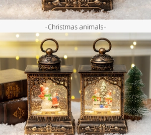 Close-up of vintage bronze Christmas lanterns with glowing LED snowman scenes inside