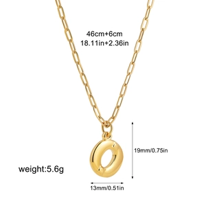 Detailed view of the golden paperclip chain necklace with a 19mm bubble letter O pendant