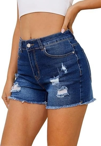 Detailed close-up of dark blue denim shorts featuring high waist and frayed hem edge