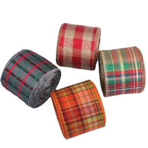 Four rolls of festive tartan ribbons with wired edges for Christmas party decoration