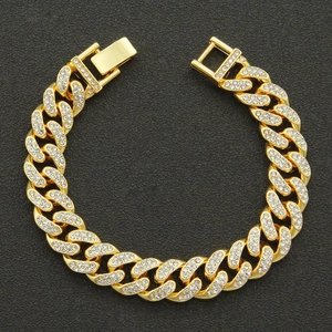 Men's hip-hop gold Cuban link bracelet with iced-out rhinestones on black texture