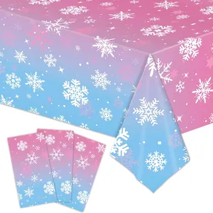 Detail view of snowflake pattern on pink and blue gradient disposable party tablecloth