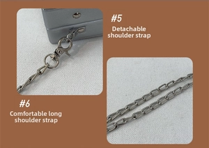 Detail of silver camera box bag featuring detachable metal chain strap with lobster clasp