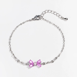 Detail of silver chain bracelet with pink butterfly charm and adjustable lobster clasp