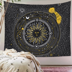 Detail of celestial tapestry featuring sun and moon patterns in a cozy bedroom setting