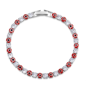 Detail of silver tennis bracelet featuring red evil eye beads and sparkling cubic zirconia