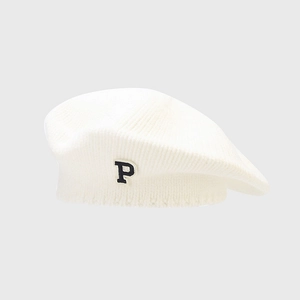 Close-up of knit texture and embroidered letter P on the white vintage beret hat