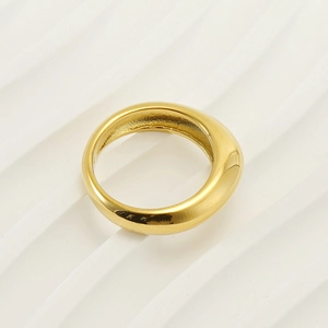 Minimalist 18k gold plated stainless steel chunky dome ring on white texture background