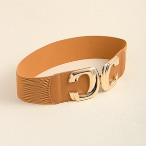Detailed view of wide elastic belt with gold double C buckle and brown litchi leather texture
