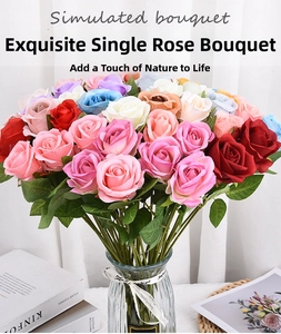 Detailed view of artificial silk roses in a glass vase with realistic texture and vibrant colors