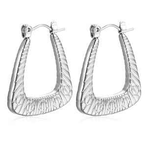 Elegant silver U-shaped stainless steel earrings with textured stripes and circular patterns