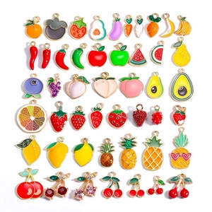 Assorted colorful enamel fruit pendants for DIY jewelry making on white background
