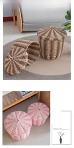 Detail of hand-woven storage baskets with lids in Nordic style and striped patterns