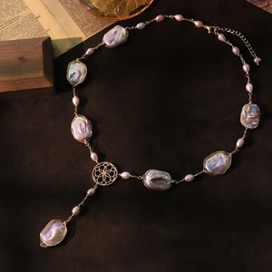 Vintage Baroque pearl necklace with iridescent pearls and golden floral pendant