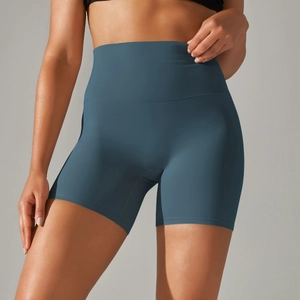 Close-up of high-waist yoga shorts with tummy control and seamless athletic fit