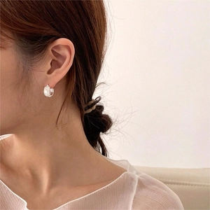 Elegant 925 sterling silver pearl earrings with beaded edge worn by a female model