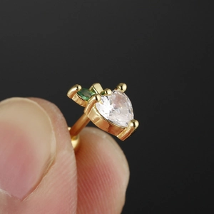 Golden heart-shaped surgical steel earring with clear and olive green zirconia stones