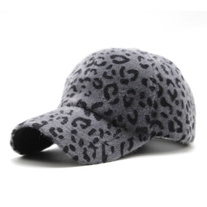 Close-up of grey leopard print plush baseball cap with curved brim and soft fuzzy texture