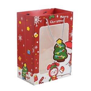 Red Christmas paper gift bag with window and tree tag featuring Merry Christmas text