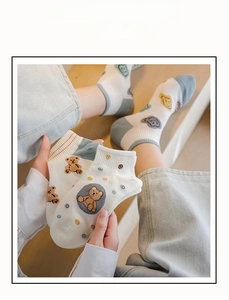 Close-up of women's cotton ankle socks with cute cartoon bear embroidery and ribbed cuffs