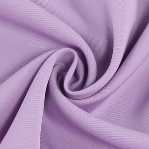 Macro shot of purple twill dress fabric with a soft luster and elegant drape texture