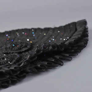 Detail of hand-hooked mesh bucket hat with colorful sequins and double-layered organza edge