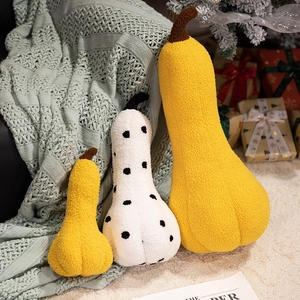 Plush pumpkin pillows in yellow and cream boucle fabric for Halloween home decor