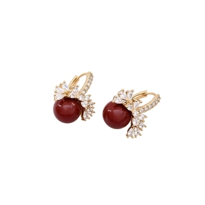 18k gold plated earrings featuring large deep red pearls and sparkling zircon accents