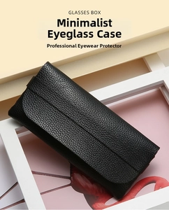 Close-up of portable black lychee pattern leather glasses case on a flamingo background