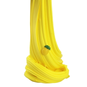 Detailed view of yellow pineapple butter slime texture with small pineapple charm