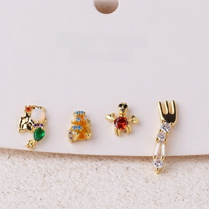 Close-up of little mermaid earring set with colorful crystals and gold plating