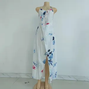 Detail of white floral sundress featuring front tie chest and leg slit on mannequin