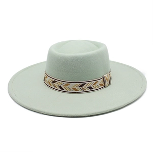 Detail of light mint wool felt fedora featuring a woven geometric ethnic style band