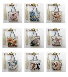 Collage of canvas tote bags with various floral and cat prints and striped handles