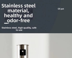 Detail of a brushed stainless steel oil sprayer bottle with a sleek black press nozzle