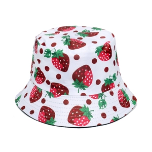White bucket hat featuring strawberry and polka dot print with reinforced stitching