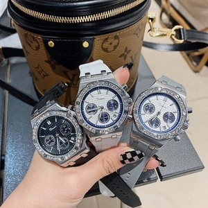 Three rhinestone-encrusted octagonal chronograph watches with rubber straps in black white grey