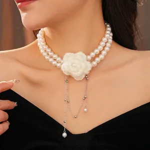 Double-layer pearl choker necklace with crochet flower and elegant silver tassel fringe