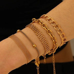 Five-piece 18K gold-plated woven mesh bracelet set for women on black background