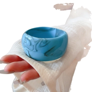 Minimalist wide wave bangle with blue marble pattern and glossy finish resin