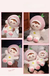 Detailed comparison of pink peach plush doll in two sizes on cozy home background
