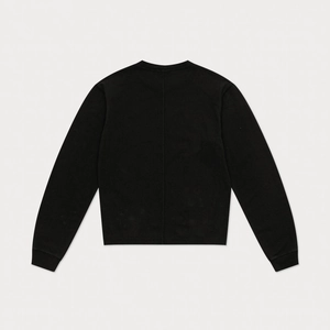 Detail view of the vertical stitching on the back of this black cotton long sleeve top