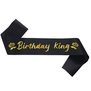 Elegant black satin Birthday King sash with gold foil lettering and crown icons