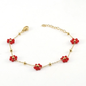 Golden stainless steel chain bracelet featuring delicate red beaded flowers and lobster clasp