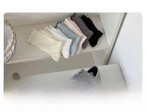 Detail of ruffled cuff socks in six assorted colors with ribbed cotton texture